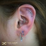 Triple Helix wth Curved Bar and two delicate Trinities
