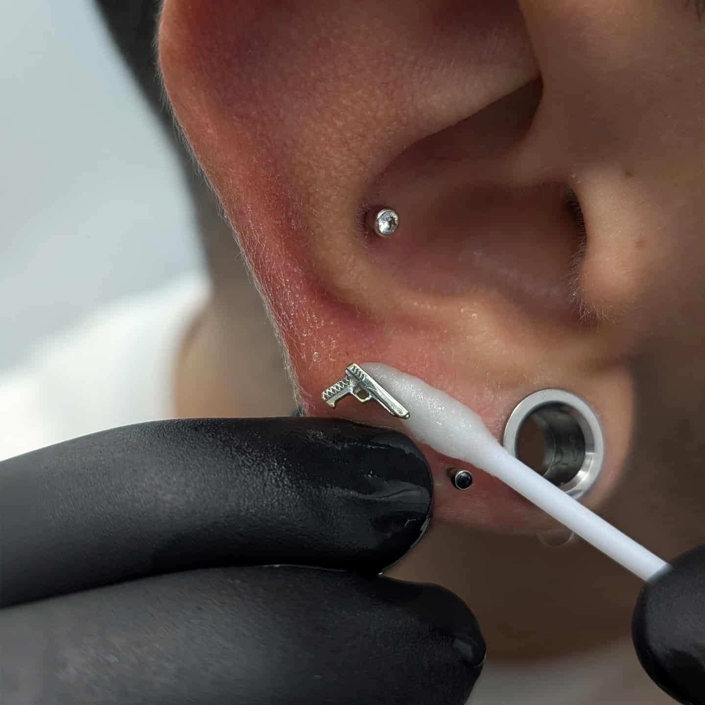 Gently clean both sides of the piercing and the jewellery too. Make sure to remove all the crusties and build up.